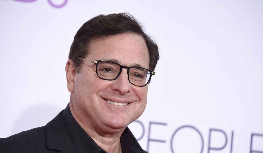 Bob Saget arrives at the People&#39;s Choice Awards at the Microsoft Theater on Wednesday, Jan. 18, 2017, in Los Angeles. Saget, a comedian and actor known for his role as a widower raising a trio of daughters in the sitcom “Full House,” has died, according to authorities in Florida, Sunday, Jan. 9, 2022. He was 65. (Photo by Jordan Strauss/Invision/AP, File)