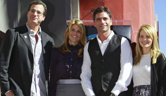 Actor John Stamos, second right, is joined by former cast members from the family comedy series, &amp;quot;Full House,&amp;quot; Bob Saget, left, Lori Laughlin, second left, and Candace Cameron Bure as Stamos is honored with star on the Hollywood Walk of Fame Monday, Nov. 16, 2009, in Los Angeles. (AP Photo/Damian Dovarganes, File)