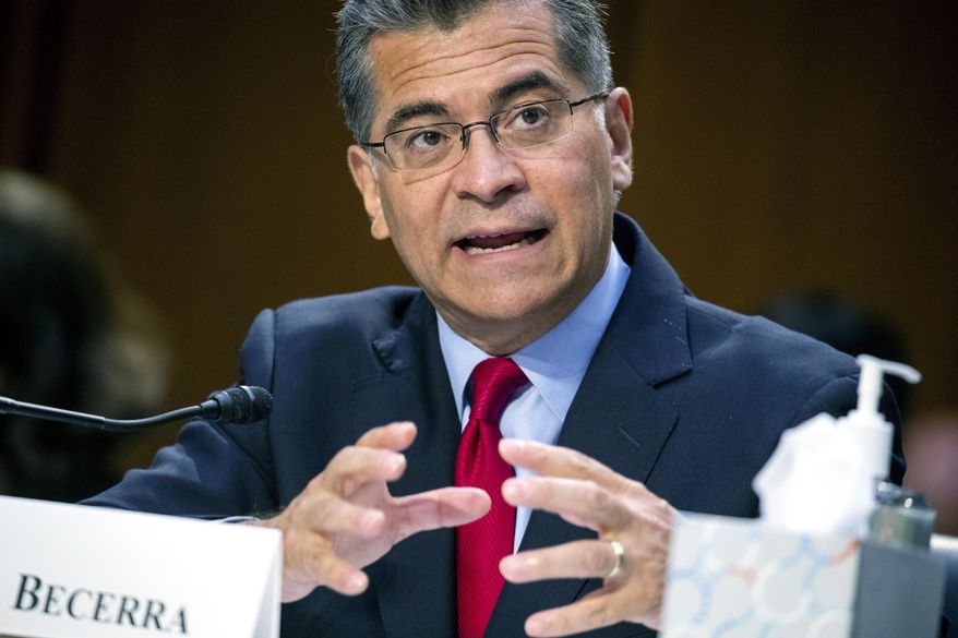 FILE - Secretary of Health and Human Services Xavier Becerra testifies before a Senate Health, Education, Labor, and Pensions Committee hearing, Sept. 30, 2021 on Capitol Hill in Washington. U.S. health secretary Xavier Becerra is ordering Medicare to reassess a big premium increase facing millions of seniors this year. The increase was largely attributed to a pricey new Alzheimer’s drug with questionable benefits. Becerra’s directive on Monday comes days after drugmaker Biogen slashed the price of its $56,000-a-year medication, Aduhelm, to $28,200 a year — a cut of about half.  (Shawn Thew/Pool via AP, File)