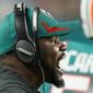 Miami Dolphins head coach Brian Flores shouts from the sidelines during the second half of an NFL football game against the New England Patriots, Sunday, Jan. 9, 2022, in Miami Gardens, Fla. (AP Photo/Wilfredo Lee)