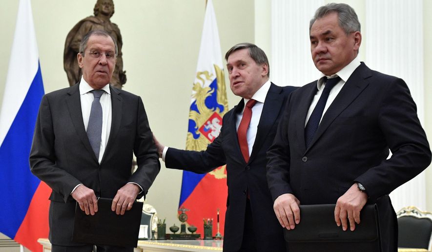 Russian Foreign Minister Sergey Lavrov, left, presidential aide Yury Ushakov, center, and Defense Minister Sergei Shoigu wait for the beginning of the Russia-Turkey talks in the Kremlin iin Moscow, Russia, Jan. 23, 2019. While demanding a halt to NATO&#39;s eastward expansion, Moscow has also urged the U.S. and its allies not to deploy weapons or conduct any military activities in Ukraine and other ex-Soviet nations. (Alexander Nemenov/Pool Photo via AP) **FILE**