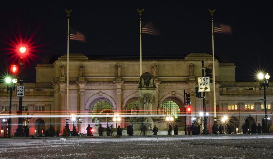 In this file photo birdwatchers line Columbus Circle in front of Union Station in Washington, Friday, Jan. 7, 2022. On the morning of Jan. 28, several swastikas were discovered scrawled on the building&#39;s pillars. (AP Photo/Carolyn Kaster)