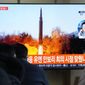 People watch a TV showing a file image of North Korea&#39;s missile launch during a news program at the Seoul Railway Station in Seoul, South Korea, Tuesday, Jan. 11, 2022. North Korea on Tuesday fired what appeared to be a ballistic missile into its eastern sea, its second weapons launch in a week, the militaries of South Korea and Japan said. The Korean letters read &amp;quot;UN Security Council meeting.&amp;quot; (AP Photo/Ahn Young-joon)