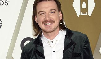 FILE - Morgan Wallen arrives at the 53rd annual CMA Awards on Nov. 13, 2019, in Nashville, Tenn. The Grand Ole Opry, country music&#39;s most historic and storied stage, is getting heavy criticism for an appearance by the country star. Wallen&#39;s surprise performance has given many the impression that the institution has given the star its blessing and a path to reconciliation after he was caught on camera last year using a racial slur. (Photo by Evan Agostini/Invision/AP, File)