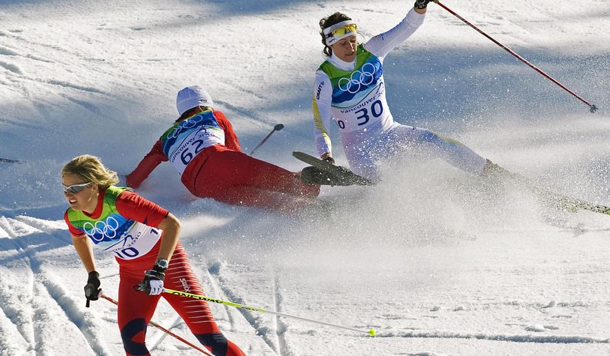 FILE - Norway&#39;s Vibeke Skofterud, left, escapes a crash involving Sweden&#39;s Norgren Johansson, right, and Poland&#39;s Paulina Maciuszek in the women&#39;s 15-kilometer pursuit cross country skiing event at Whistler Olympic Park on February 19, 2010, at the 2010 Vancouver Olympic Winter Games in Whistler, B.C. Many top Nordic skiers and biathletes say crashes are becoming more common as climate change reduces the availability of natural snow, forcing racers to compete on tracks with the manmade version. (AP Photo/Andrew Vaughan, CP, File)
