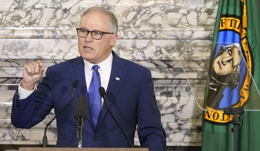 Washington Gov. Jay Inslee gives his annual State of the State address, Tuesday, Jan. 11, 2022, at the Capitol in Olympia, Wash. Due to cautions against COVID-19, Inslee gave his speech in the State Reception Room and it was shown by streaming video to lawmakers meeting remotely. (AP Photo/Ted S. Warren) ** FILE **