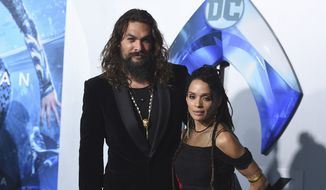 Jason Momoa, left, and Lisa Bonet arrive at the premiere of &quot;Aquaman&quot; at TCL Chinese Theatre on Wednesday, Dec. 12, 2018, in Los Angeles. They have ended their 16-year relationship. A joint statement posted on the “Aquaman” star’s Instagram page Wednesday, Jan. 12, 2022, said that Momoa and his wife were parting ways. (Photo by Jordan Strauss/Invision/AP, File)