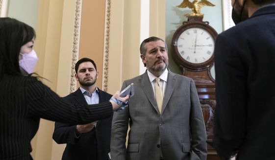 Sen. Ted Cruz, R-Texas, second from right, speaks with reporters on Capitol Hill, Wednesday, Jan. 12, 2022, in Washington. (AP Photo/Alex Brandon) **FILE**