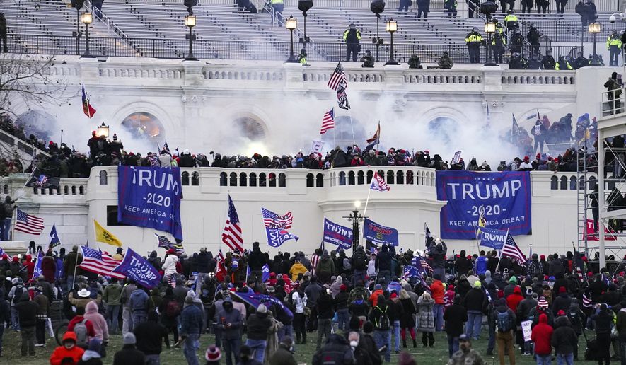 Violent protesters, loyal to President Donald Trump, storm the Capitol in Washington on  Jan. 6, 2021. (AP Photo/John Minchillo, File)