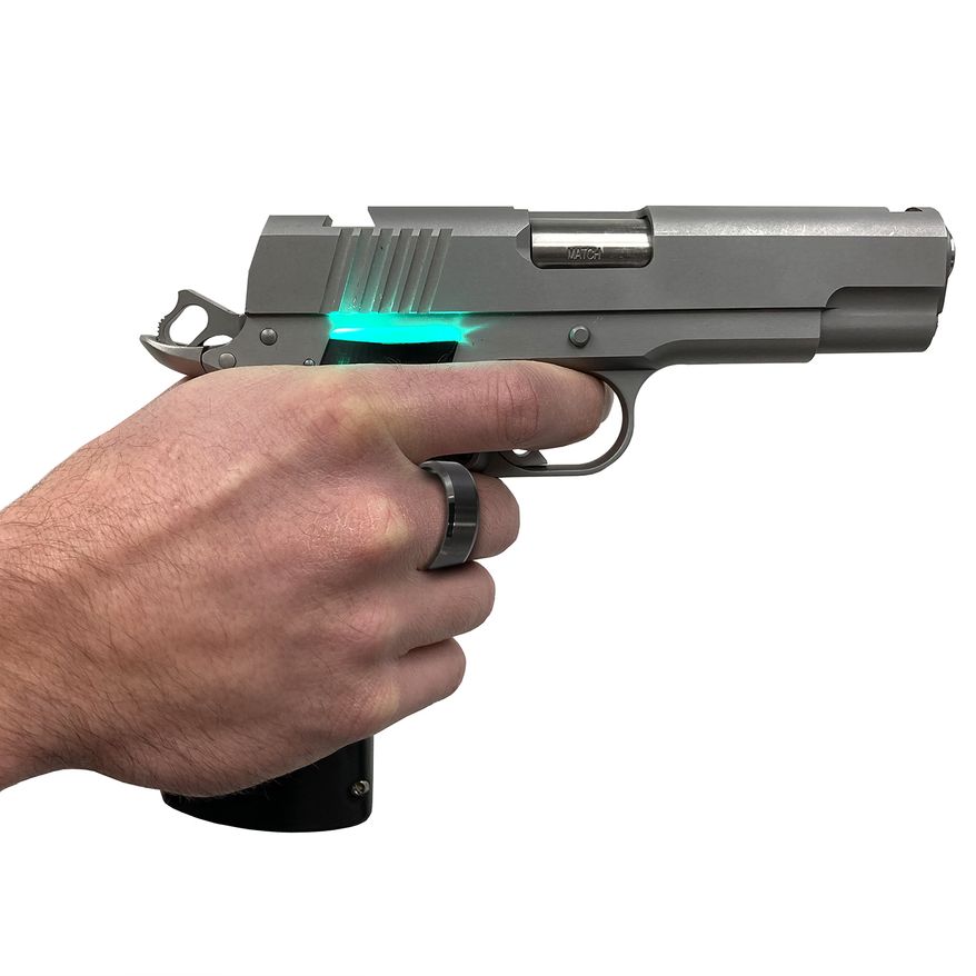 The SmartGunz 1911 Sentry only fires when the user wears a special RFID chip ring on the index or middle finger of their trigger hand while firmly gripping the handle. It will start shipping to U.S. consumers in April. (Photo courtesy of SmartGunz LLC)