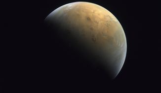 This Feb. 10, 2021, file image taken by the United Arab Emirates&#x27; &amp;quot;Amal,&amp;quot; or &amp;quot;Hope,&amp;quot; probe released Sunday, Feb. 14, 2021, shows Mars. Scientists say they&#x27;ve confirmed the meteorite from Mars contains no evidence of ancient Martian life. The rock caused a splash 25 years ago when a NASA-led team announced that its organic compounds may have been left by living creatures, however primitive. Researchers chipped away at that theory over the decades. A team of scientists led by Andrew Steele of the Carnegie Institution published their findings Thursday, Jan. 13, 2022. (Mohammed bin Rashid Space Center/UAE Space Agency, via AP) ** FILE **