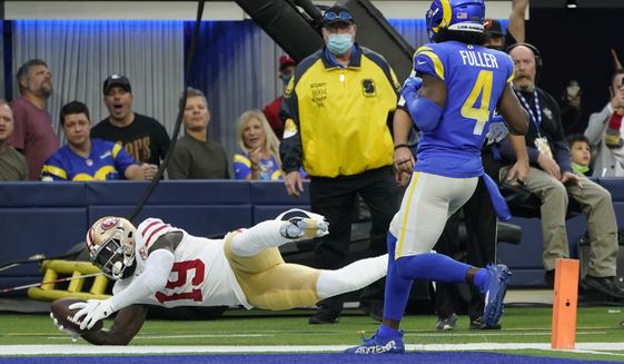 San Francisco 49ers wide receiver Deebo Samuel (19) scores a touchdown during the second half of an NFL football game against the Los Angeles Rams, Sunday, Jan. 9, 2022, in Inglewood, Calif. (AP Photo/Marcio Jose Sanchez)