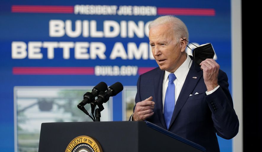 President Joe Biden begins to speak about the Bipartisan Infrastructure Law at the South Court Auditorium in the Eisenhower Executive Office Building on the White House Campus in Washington, Friday, Jan. 14, 2022. (AP Photo/Andrew Harnik)