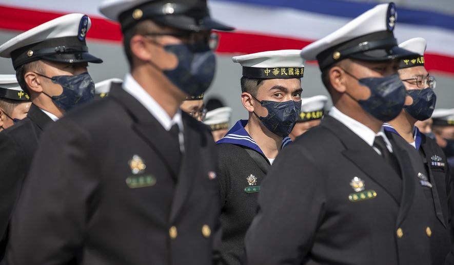 In this photo released by the Taiwan Presidential Office, Taiwanese sailors form up infront of newly commissioned navy minelayers in Kaohsiung city in southern Taiwan on Friday, Jan. 14, 2022. . (Taiwan Presidential Office via AP)  **FILE**