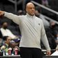 Washington Wizards head coach Wes Unseld Jr. points during the second half of an NBA basketball game against the Orlando Magic, Wednesday, Jan. 12, 2022, in Washington. The Wizards won 112-106. (AP Photo/Nick Wass)