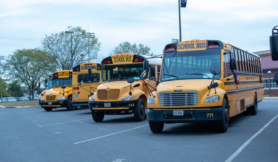 Loudoun County Public Schools buses. Brandon Michon became a YouTube sensation for excoriating the Loudon County School Board over its COVID-19 shut down and is now tapping that notoriety for a congressional run to take on a vulnerable Democrat in Northern Virginia. (Sabira Dewji via Shutterstock) **FILE**