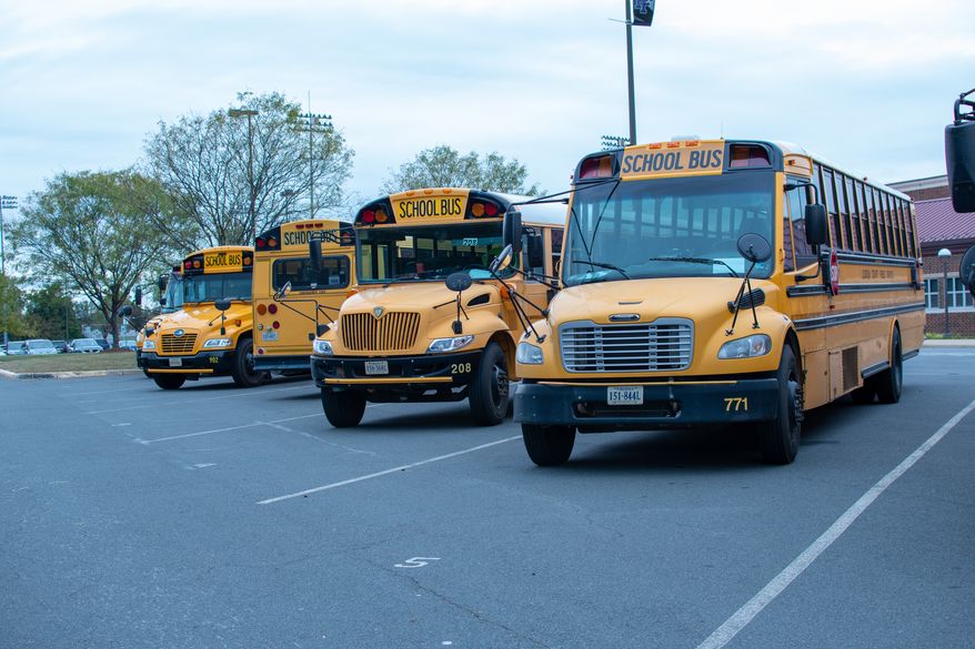 Loudoun County Public Schools buses. Brandon Michon became a YouTube sensation for excoriating the Loudon County School Board over its COVID-19 shut down and is now tapping that notoriety for a congressional run to take on a vulnerable Democrat in Northern Virginia. (Sabira Dewji via Shutterstock) **FILE**