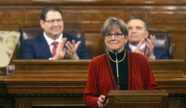 Gov. Laura Kelly is applauded as she begins addressing the Kansas Legislature for the annual State of the State, Tuesday, Jan. 11, 2022, in Topeka, Kan. (Evert Nelson/The Topeka Capital-Journal via AP)