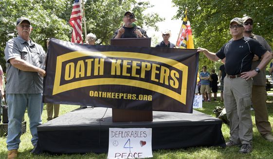 FILE - Stewart Rhodes, founder of the citizen militia group known as the Oath Keepers, center, speaks during a rally outside the White House in Washington, on June 25, 2017. The seditious conspiracy case filed this week against members and associates of the far-right Oath Keepers militia group marked the boldest attempt so far by the government to prosecute those who attacked the U.S. Capitol during the Jan. 6 riot. (AP Photo/Susan Walsh, File)