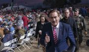 Mike Lindell, CEO of My Pillow, walks past a crowd of supporters during a rally for former President Donald Trump on Saturday, Jan. 15, 2022, in Florence, Az. (AP Photo/Nathan Howard)