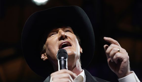 Virginia Gov. Glenn Youngkin, sporting a cowboy hat, gestures as he speaks to the crowd during an inaugural celebration Saturday Jan. 15, 2022, in Richmond, Va. (AP Photo/Steve Helber)