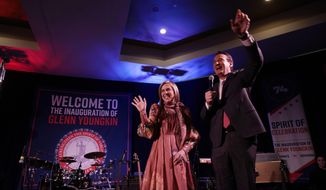 Virginia Gov.-elect Glenn Youngkin and his wife Suzanne greet supporters at a reception Friday Jan. 14, 2022, in Richmond, Va. Youngkin will be sworn in as Virginia&#39;s 74th Governor Saturday. (AP Photo/Steve Helber)