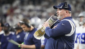 Dallas Cowboys head coach Mike McCarthy watches from the sideline during the second half of an NFL wild-card playoff football game against the San Francisco 49ers in Arlington, Texas, Sunday, Jan. 16, 2022. (Smiley N. Pool/The Dallas Morning News via AP)
