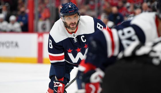 Washington Capitals Left Wing Alex Ovechkin (8) lining up for face-off during the 2nd period against the Vancouver Canucks at Capital One Arena in Washington D.C., January 16, 2022. (Photo by All-Pro Reels)