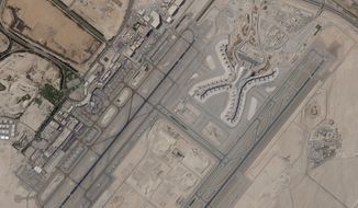 In a satellite photo by Planet Labs PBC, Abu Dhabi International Airport is seen on Dec. 8, 2021. A suspected drone attack by Yemen&#39;s Houthi rebels targeting a key oil facility in Abu Dhabi killed three people and sparked a separate fire at Abu Dhabi&#39;s international airport on Monday, Jan. 17, 2022, police said. (Planet Labs PBC via AP) ** FILE **