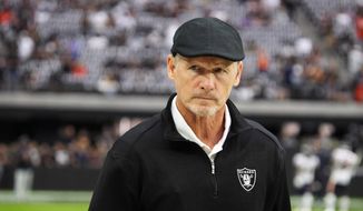 Las Vegas Raiders general manager Mike Mayock walks the sideline during an NFL football game against the Chicago Bears, Sunday, Oct. 10, 2021, in Las Vegas. On Monday, Jan. 17, 2022, the Las Vegas Raiders announced they have fired Mayock after three seasons and will begin a search for a coach and GM following their second playoff berth in the past 19 seasons. (AP Photo/Rick Scuteri, File) **FILE**