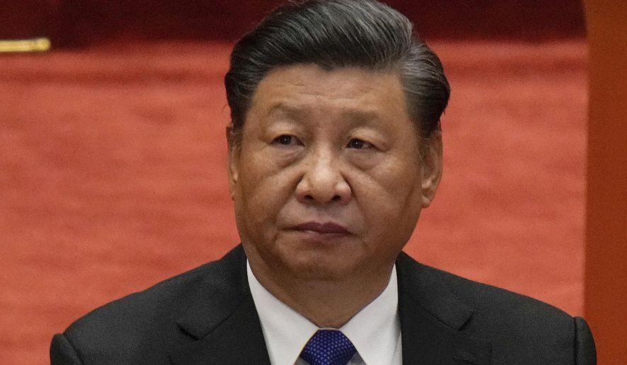 Chinese President Xi Jinping attends an event commemorating the 110th anniversary of Xinhai Revolution at the Great Hall of the People in Beijing on Oct. 9, 2021. The Chinese leader was the headline speaker for the start of the virtual “Davos Agenda” meeting on Monday, Jan. 17, 2022, an alternative to the World Economic Forum’s annual meeting in Davos, Switzerland, whose in-person version has been postponed because of health concerns linked to the COVID-19 pandemic. (AP Photo/Andy Wong, File)