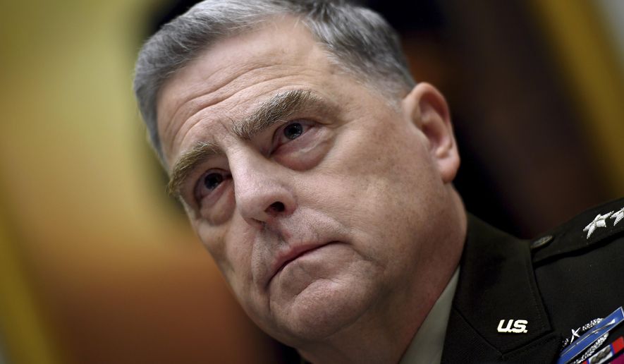 FILE - Gen. Mark Milley, chairman of the Joint Chiefs of Staff, listens during a House Armed Services Committee hearing on the conclusion of military operations in Afghanistan, Sept. 29, 2021, on Capitol Hill in Washington.  Milley has tested positive for COVID-19 and is experiencing very minor symptoms, a spokesperson said Monday. (Olivier Douliery/Pool via AP, File)