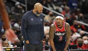 Washington Wizards acting head coach Joseph Blair talks with guard Bradley Beal (3) during the first half of an NBA basketball game against the Philadelphia 76ers, Monday, Jan. 17, 2022, in Washington. (AP Photo/Nick Wass) **FILE**