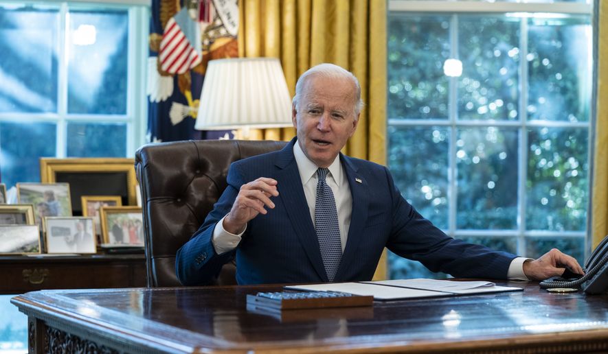 President Joe Biden speaks before signing an executive order to improve government services, in the Oval Office of the White House, Dec. 13, 2021, in Washington. (AP Photo/Evan Vucci, File)
