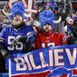 Buffalo Bills fans celebrate during the second half of an NFL wild-card playoff football game against the New England Patriots in Orchard Park, N.Y., Saturday, Jan. 15, 2022. (AP Photo/ Jeffrey T. Barnes)