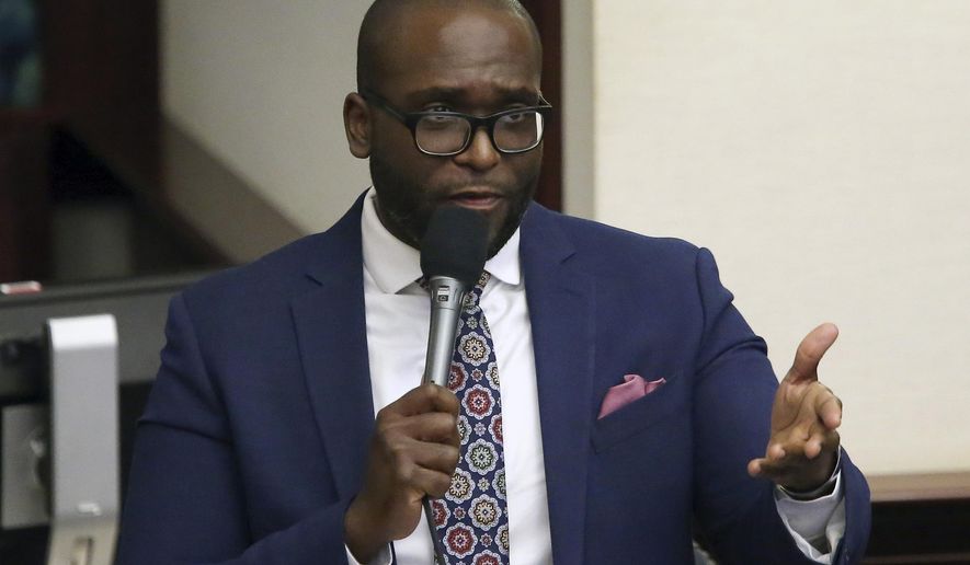 State Rep. Shevrin Jones, D-West Park, asks a question concerning the medical marijuana bill during session Wednesday, March, 13 2019, in Tallahassee, Fla. A bill pushed by Republican Florida Gov. Ron DeSantis that would prohibit public schools and private businesses from making white people feel “discomfort” when they teach students or train employees about discrimination in the nation&#x27;s past received its first approval Tuesday, Dec. 18, 2022. “This bill&#x27;s not for Blacks, this bill was not for any other race. This was directed to make whites not feel bad about what happened years ago,” said Jones. (AP Photo/Steve Cannon, File)