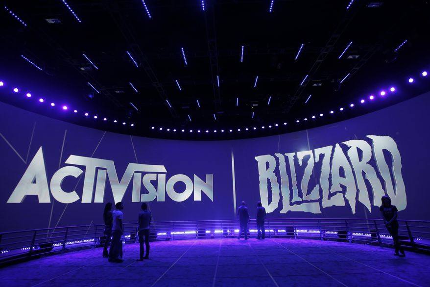 The Activision Blizzard Booth is shown on June 13, 2013 the during the Electronic Entertainment Expo in Los Angeles. Microsoft is buying Activision Blizzard, Tuesday, Jan. 18, 2022,  for $68.7 billion to gain access to blockbuster games including Call of Duty and Candy Crush. The all-cash deal will let Microsoft accelerate mobile gaming and provide it building blocks for the metaverse, or a virtual environment.  (AP Photo/Jae C. Hong, File)