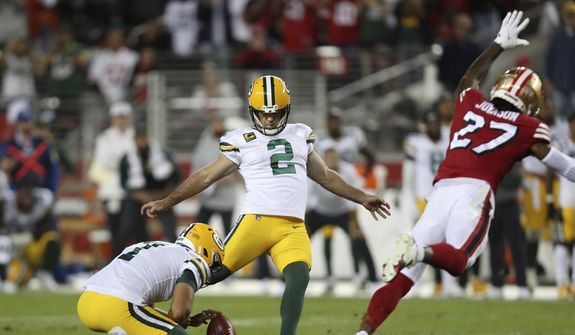 Green Bay Packers kicker Mason Crosby (2) kicks the game winning field goal from the hold of Corey Bojorquez during the second half of an NFL football game against the San Francisco 49ers in Santa Clara, Calif., Sunday, Sept. 26, 2021. The Packers and 49er meet Saturday, Jan. 22, 2022.(AP Photo/Jed Jacobsohn, File) ** FILE**