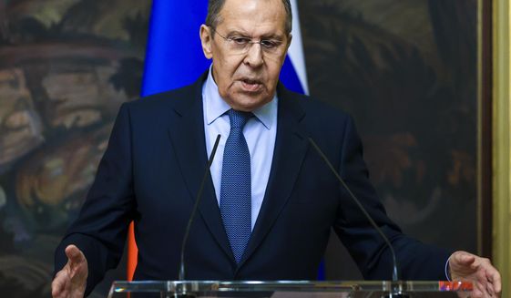 In this handout photo released by Russian Foreign Ministry Press Service, Russian Foreign Minister Sergey Lavrov gestures while speaking during a joint news conference with and German Foreign Minister Annalena Baerbock following their talks in Moscow, Russia, Tuesday, Jan. 18, 2022. (Russian Foreign Ministry Press Service via AP)