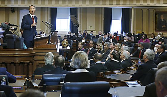 Gov. Glenn Youngkin gives his State of the Commonwealth speech to the Joint Assembly inside the House of Delegates Chamber at the State Capitol in Richmond, Va., Monday, Jan. 17, 2022. (Bob Brown/Richmond Times-Dispatch via AP)