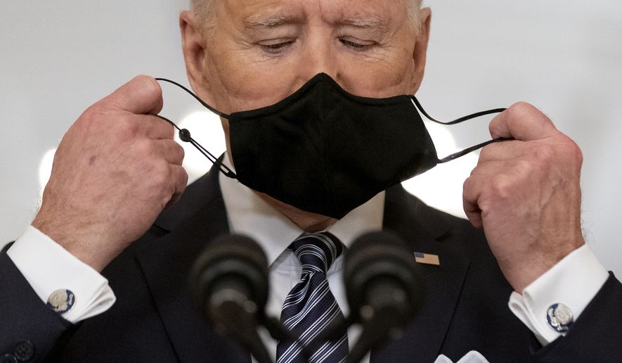 President Joe Biden takes off his mask to speak about the COVID-19 pandemic during a prime-time address from the East Room of the White House, on March 11, 2021, in Washington. (AP Photo/Andrew Harnik) **FILE**