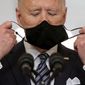 President Joe Biden takes off his mask to speak about the COVID-19 pandemic during a prime-time address from the East Room of the White House, on March 11, 2021, in Washington. (AP Photo/Andrew Harnik) **FILE**