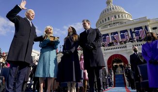 Joe Biden is sworn in as the 46th president of the United States by Chief Justice John Roberts as Jill Biden holds the Bible during the 59th Presidential Inauguration at the U.S. Capitol in Washington, on Jan. 20, 2021, as their children Ashley and Hunter watch. (AP Photo/Andrew Harnik, Pool, File)