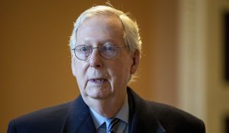 Senate Minority Leader Mitch McConnell, R-Ky., speaks to a reporter at the Capitol in Washington, Wednesday, Jan. 19, 2022. (AP Photo/Amanda Andrade-Rhoades) **FILE**