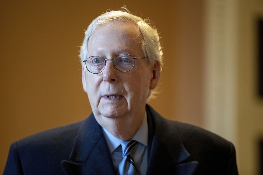 Senate Minority Leader Mitch McConnell, R-Ky., speaks to a reporter at the Capitol in Washington, Wednesday, Jan. 19, 2022. (AP Photo/Amanda Andrade-Rhoades) **FILE**