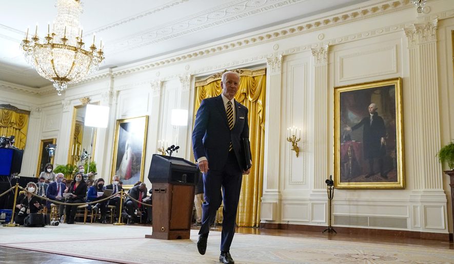 President Joe Biden leaves after a news conference in the East Room of the White House in Washington, Wednesday, Jan. 19, 2022. (AP Photo/Susan Walsh)