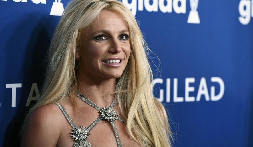 This April 12, 2018, file photo shows Britney Spears at the 29th annual GLAAD Media Awards in Beverly Hills, Calif. Disability rights activists and advocates for Britney Spears backed a California proposal Wednesday, Jan. 18, 2022, to provide more protections for those under court-ordered conservatorships, while promoting less-restrictive alternatives. (Photo by Chris Pizzello/Invision/AP, File)