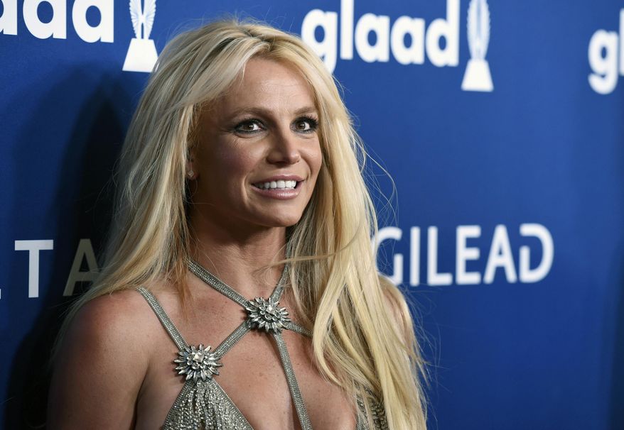 This April 12, 2018, file photo shows Britney Spears at the 29th annual GLAAD Media Awards in Beverly Hills, Calif. Disability rights activists and advocates for Britney Spears backed a California proposal Wednesday, Jan. 18, 2022, to provide more protections for those under court-ordered conservatorships, while promoting less-restrictive alternatives. (Photo by Chris Pizzello/Invision/AP, File)