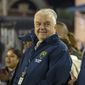 Nevada Gov. Steve Sisolak stands on the sidelines before a NCAA college football game in Reno, Nev., on Oct. 29, 2021. (AP Photo/Tom R. Smedes, File)