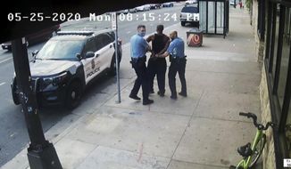 This image from video shows Minneapolis police Officers Thomas Lane, left and J. Alexander Kueng, right, escorting George Floyd, center, to a police vehicle outside Cup Foods in Minneapolis, on May 25, 2020. Three former Minneapolis officers headed to trial this week on federal civil rights charges in the death of George Floyd aren&#39;t as familiar to most people as Derek Chauvin, a fellow officer who was convicted of murder last spring. (Court TV via AP, Pool, File)